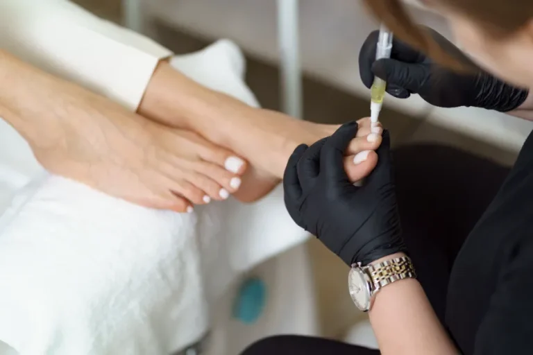 A woman's feet having a pedicure in a nail salon.